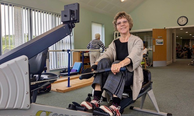 person using a rowing machine